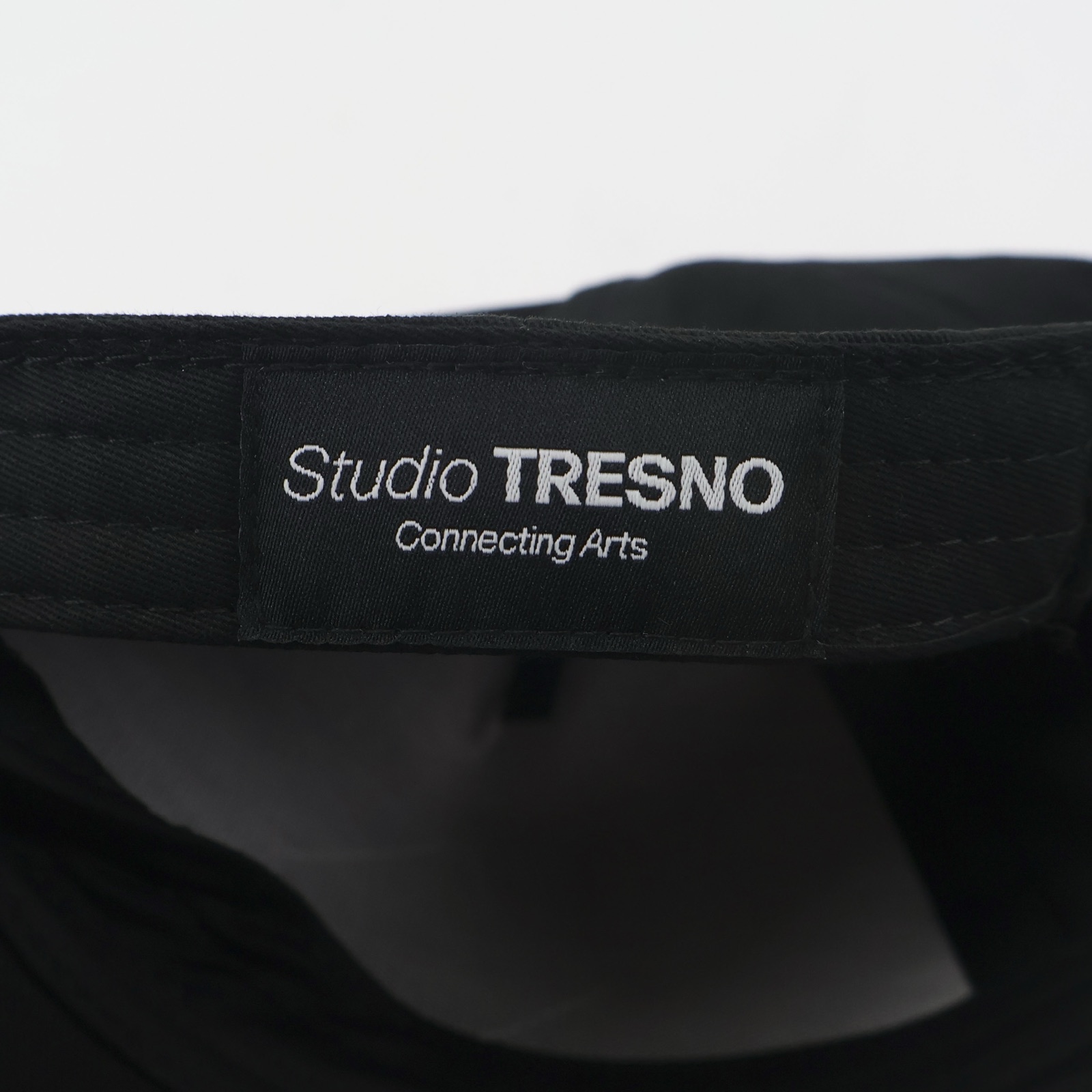 Close-up of the Tresno chrest embroidery on the cap