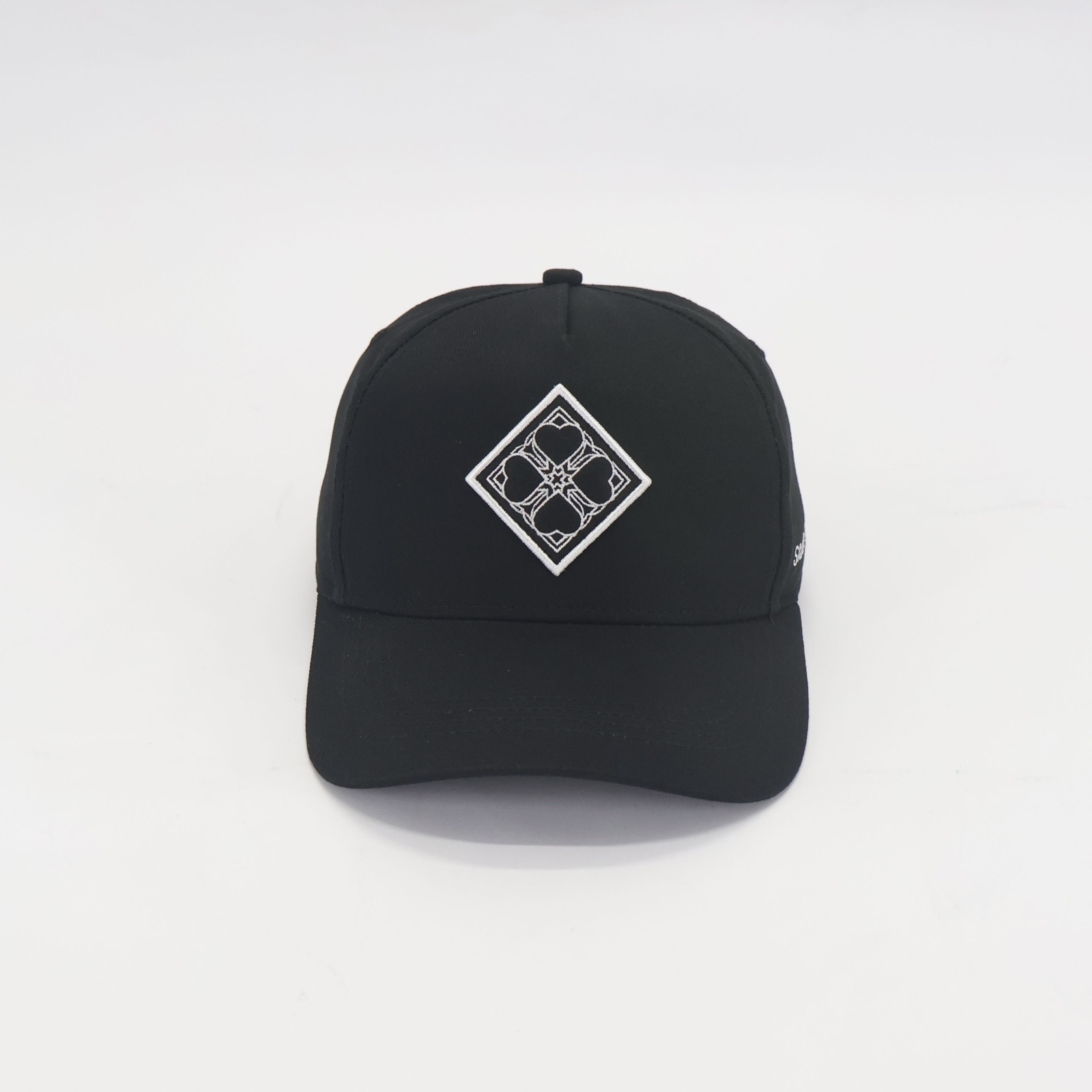 Tresno Crest Cap in carbon black, front view showing the embroidered chrest